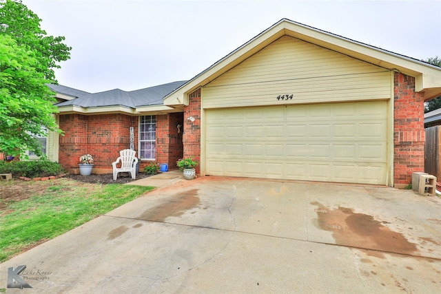 single story home featuring a garage