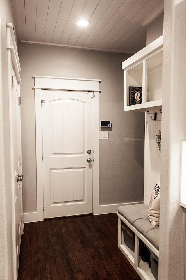 mudroom with baseboards, dark wood finished floors, and wood ceiling