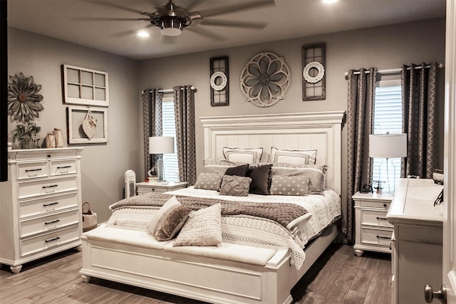 bedroom with recessed lighting, multiple windows, and wood finished floors