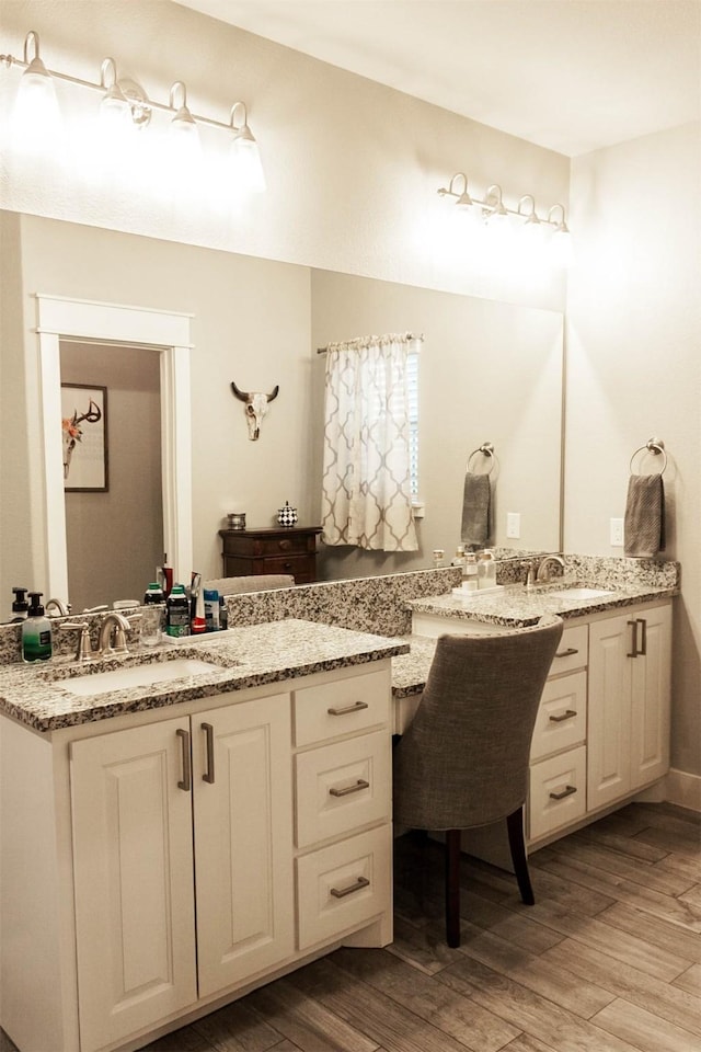 full bath with vanity and wood finished floors