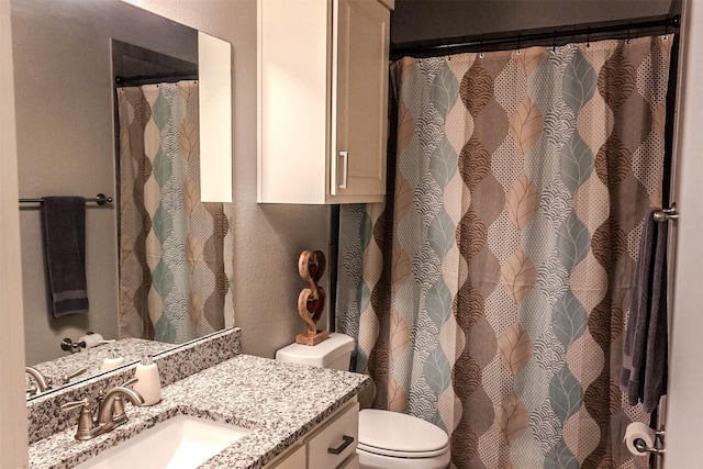 full bath with vanity and toilet