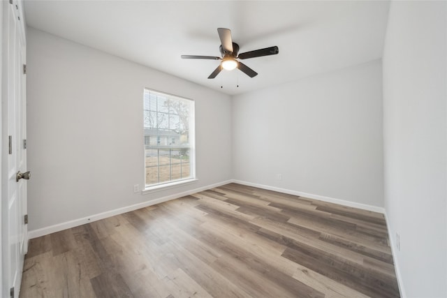 empty room with wood-type flooring and ceiling fan