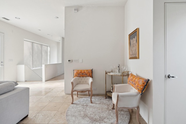 sitting room with light tile patterned flooring