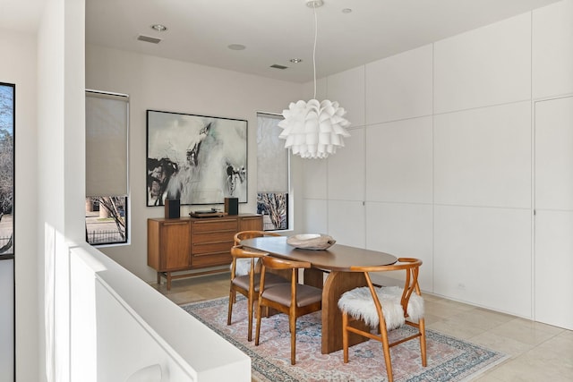 dining space featuring light tile patterned floors