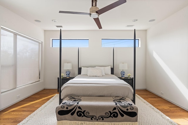 bedroom featuring wood-type flooring and ceiling fan