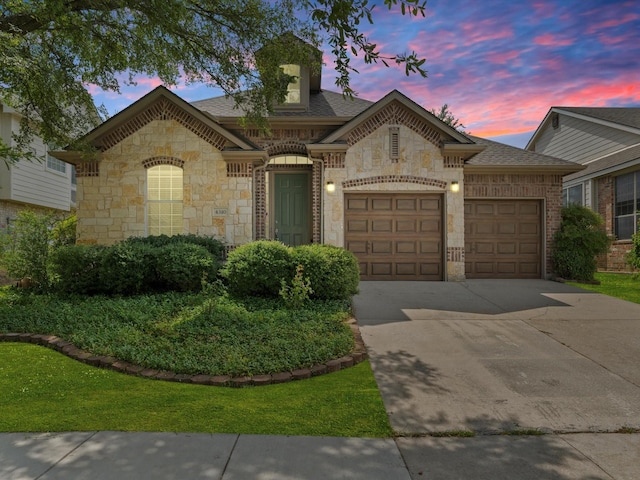 view of front of property with a garage