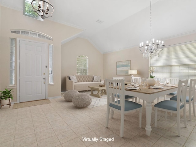 tiled dining space with ornamental molding and a chandelier