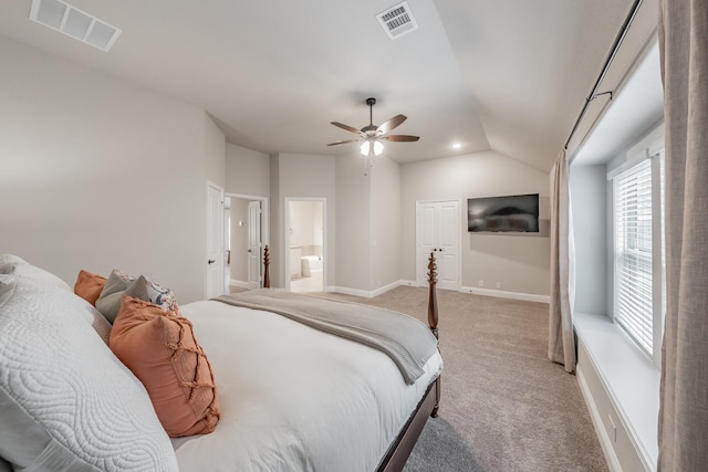 bedroom with lofted ceiling, baseboards, visible vents, and light colored carpet