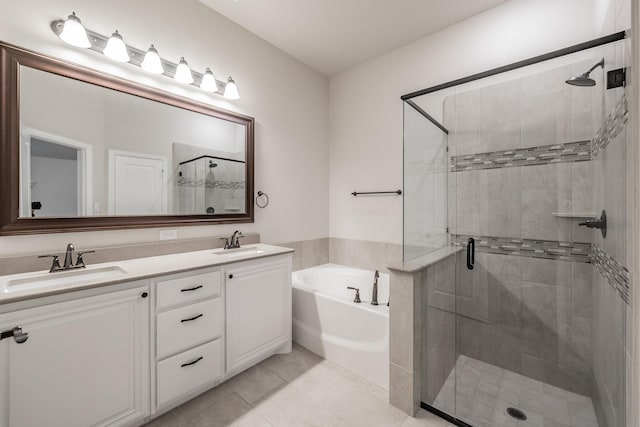 full bath featuring a garden tub, a sink, a shower stall, and double vanity