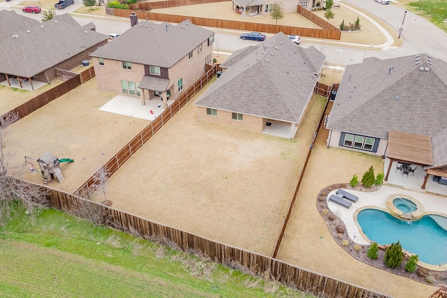 birds eye view of property with a residential view