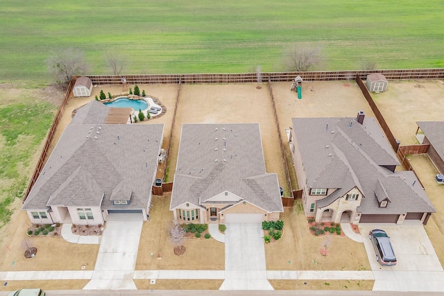 birds eye view of property with a rural view