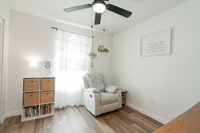 sitting room with dark hardwood / wood-style flooring