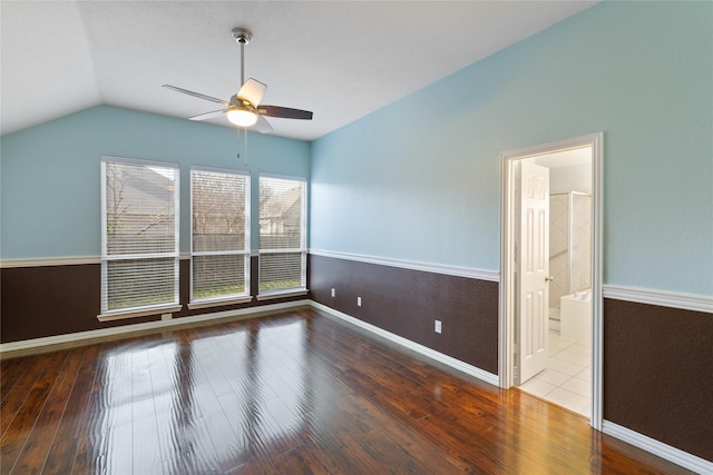 spare room featuring lofted ceiling, hardwood / wood-style floors, and ceiling fan