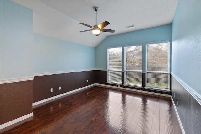 unfurnished room with ceiling fan, lofted ceiling, and dark hardwood / wood-style floors