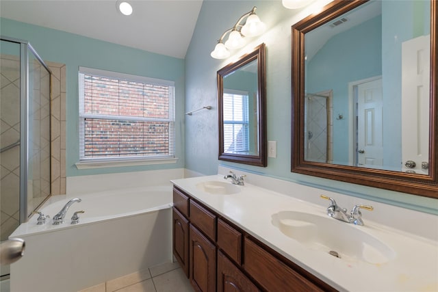 bathroom with vaulted ceiling, shower with separate bathtub, tile patterned floors, and vanity