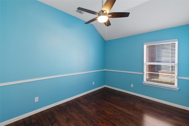 spare room with ceiling fan, lofted ceiling, and wood-type flooring