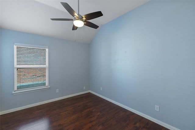 empty room featuring ceiling fan, lofted ceiling, and dark hardwood / wood-style flooring