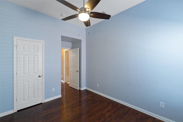 unfurnished bedroom with dark hardwood / wood-style flooring and ceiling fan