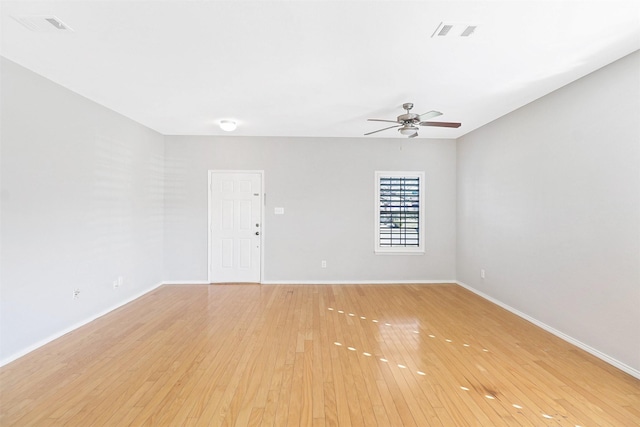 empty room with ceiling fan and light wood-type flooring