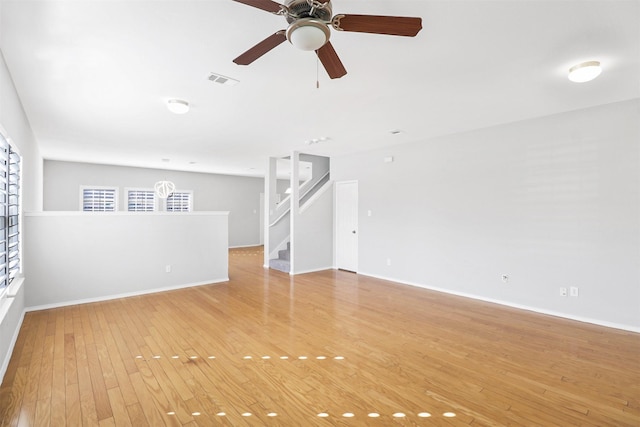 empty room featuring ceiling fan and light wood-type flooring