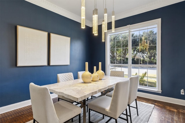 dining area featuring ornamental molding and dark wood-type flooring