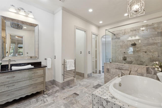 bathroom with vanity, crown molding, and independent shower and bath