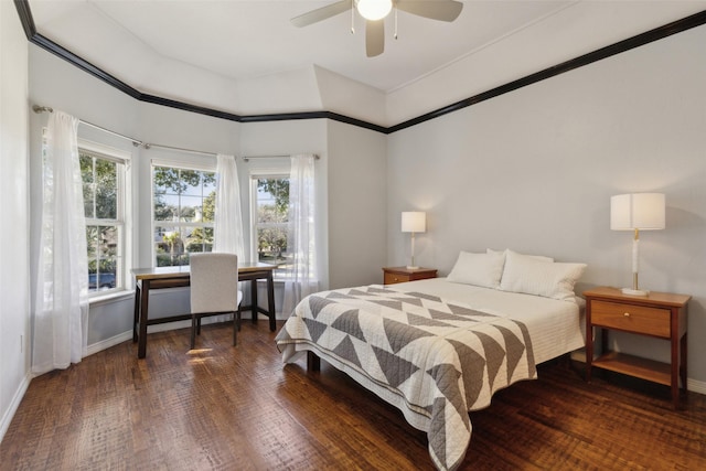 bedroom with multiple windows, dark wood-type flooring, and ceiling fan