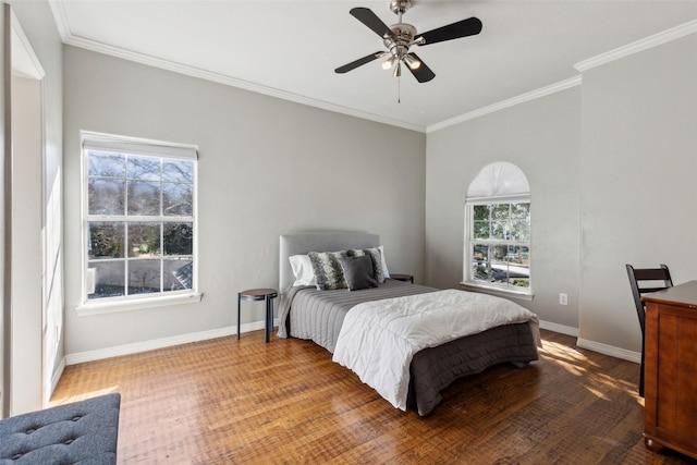 bedroom featuring ornamental molding, hardwood / wood-style floors, and ceiling fan