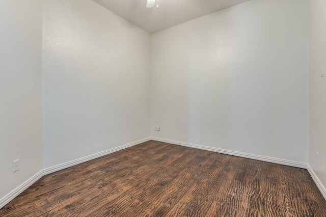 empty room featuring dark hardwood / wood-style floors and ceiling fan