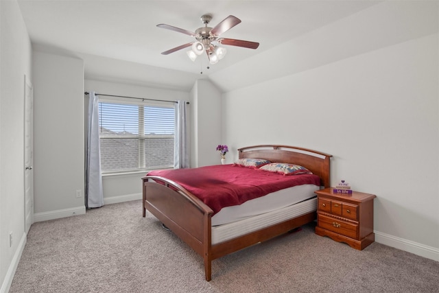 bedroom featuring vaulted ceiling, light carpet, and ceiling fan