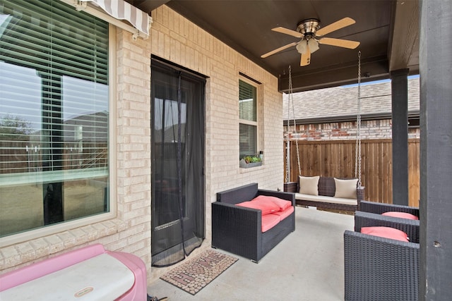 view of patio with ceiling fan and an outdoor living space