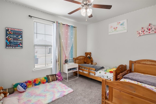 carpeted bedroom featuring ceiling fan