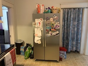 kitchen featuring stainless steel refrigerator