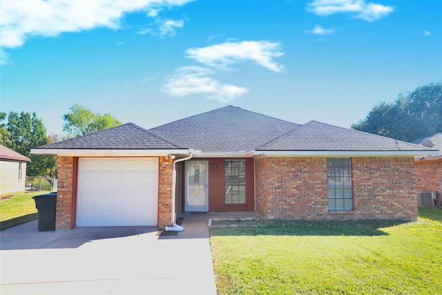 single story home featuring a garage, cooling unit, and a front yard