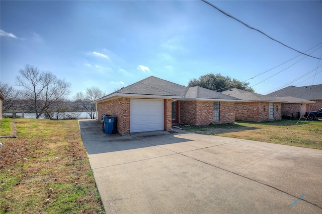 view of front of home with a garage and a front yard