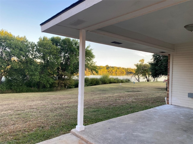 view of patio featuring a water view