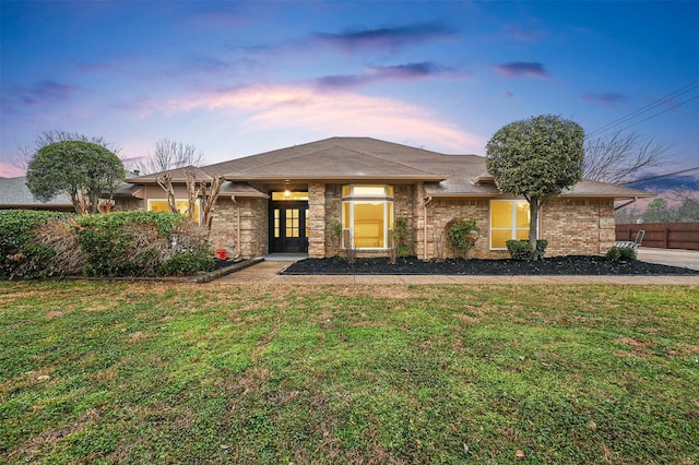 view of front of home with a lawn