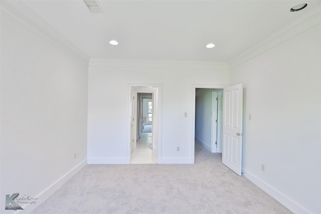 unfurnished bedroom featuring ornamental molding and light carpet