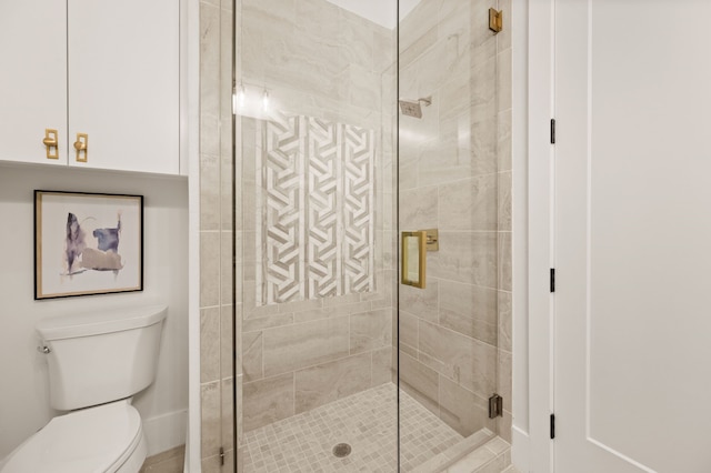 bathroom featuring walk in shower and toilet