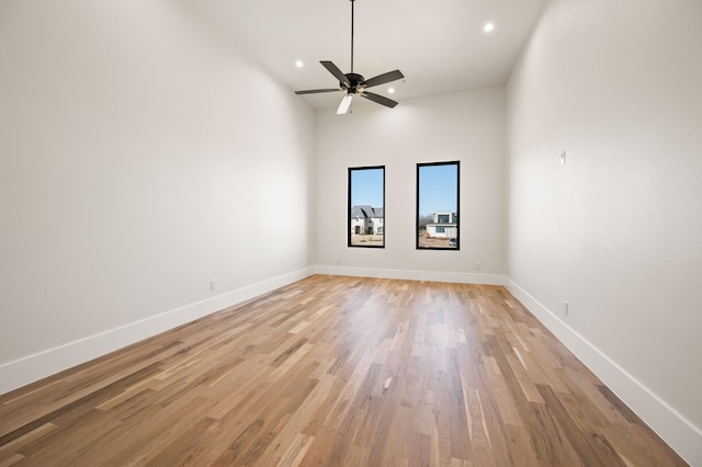 spare room featuring ceiling fan and light hardwood / wood-style floors