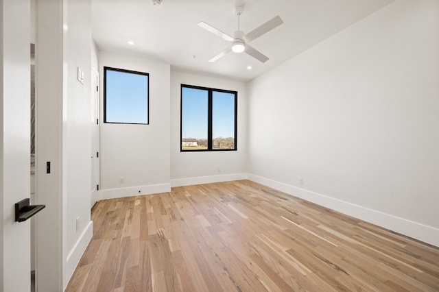 spare room featuring ceiling fan and light hardwood / wood-style flooring