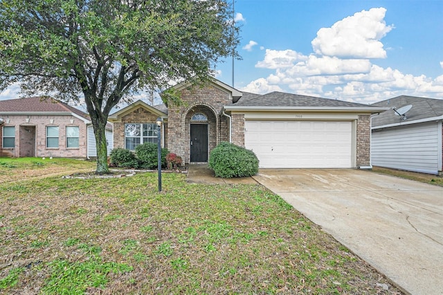 ranch-style home featuring a garage and a front yard