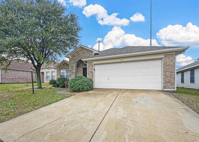 single story home with a garage and a front yard