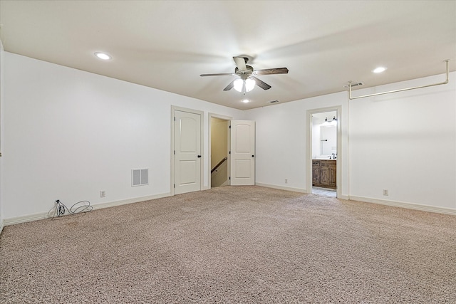 597 Imagine Dr, Lindale, TX 75771 - unfurnished bedroom featuring carpet floors, connected bathroom, and ceiling fan