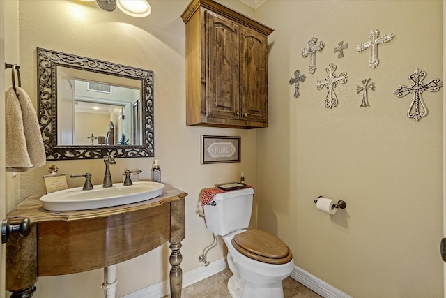 597 Imagine Dr, Lindale, TX 75771 - bathroom with toilet, tile patterned flooring, and sink