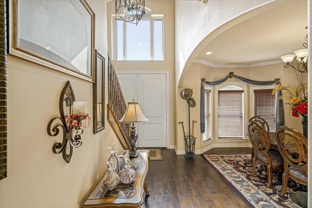597 Imagine Dr, Lindale, TX 75771 - entryway featuring crown molding, dark wood-type flooring, and a chandelier