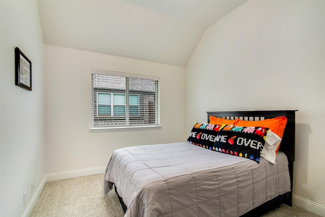 carpeted bedroom featuring vaulted ceiling