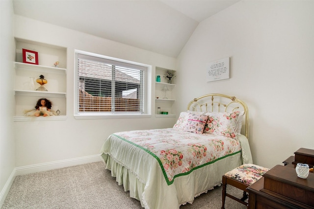 carpeted bedroom with vaulted ceiling