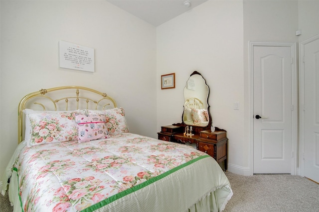 bedroom with lofted ceiling and carpet