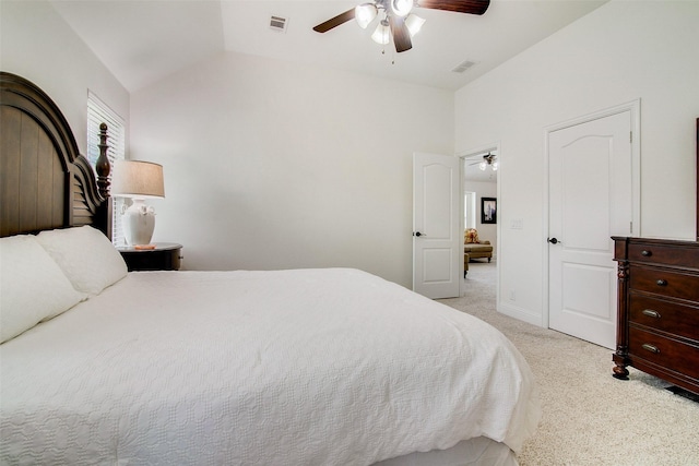 bedroom featuring lofted ceiling, light carpet, and ceiling fan